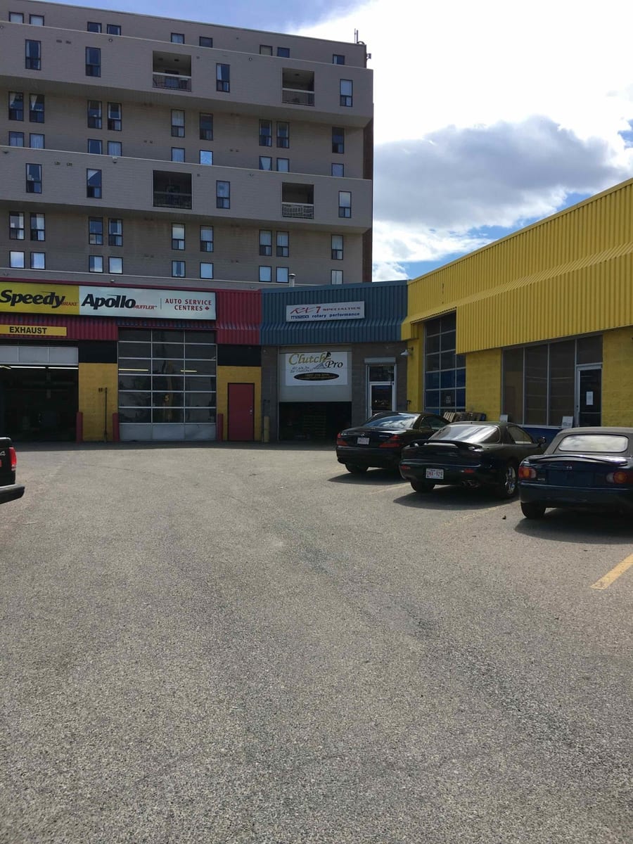The row of shops on 17 Avenue SW from the parking lot, the Clutch-Pro unit at the right